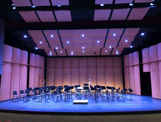 Performing arts center stage with music stands