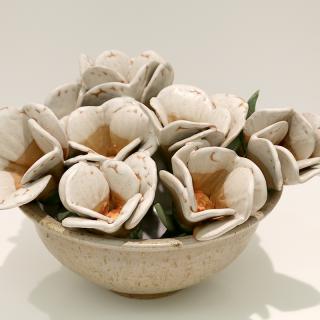A pot with artificial flowers.