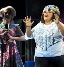 Woman singing in theatre production