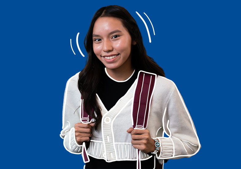 An Indigenous student wearing a backpack on a solid background