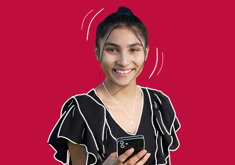 A female student holding a cell phone on a solid background