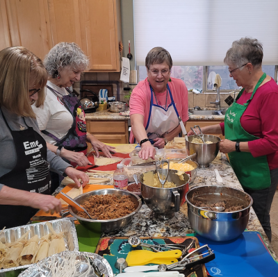 Women making tamales together