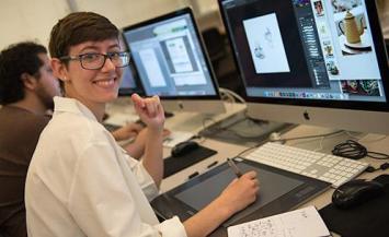 person at computer working on design program