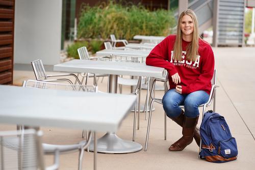 A student sitting outside.