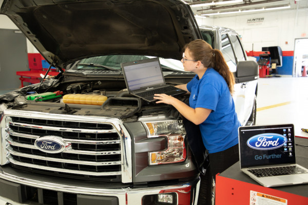 Girl working on Ford truck