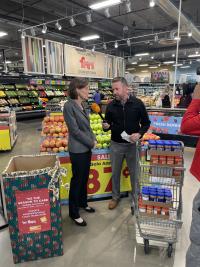 Ian Schwartz interviewing a lady in a grocery store