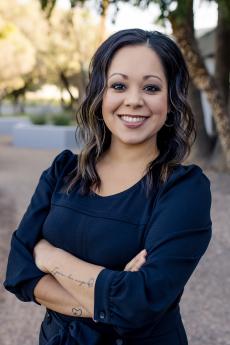 Priscilla Gutierrez in a black dress with arms crossed her chest
