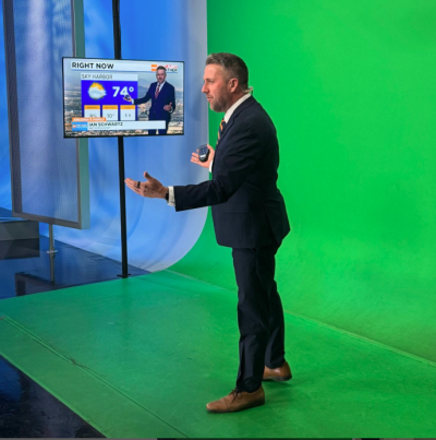 Ian Schwartz in front of a green screen