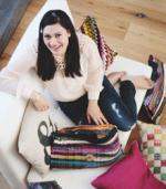 Jennifer Boonlorn posing with handbags