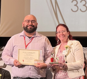Adrian Moreno with the contest co-chair.