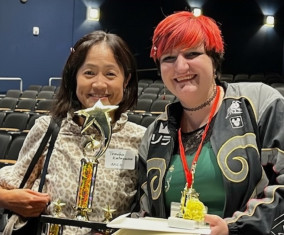 Professor Tomoko Katayama (left) with Aislynn Carpenter (right) holding the Grand Prize trophy.