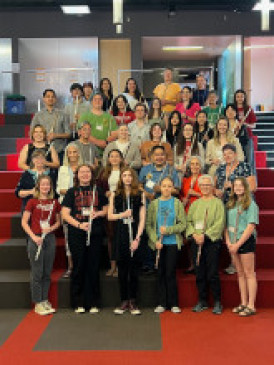 Group of 30 flutists in colorful 