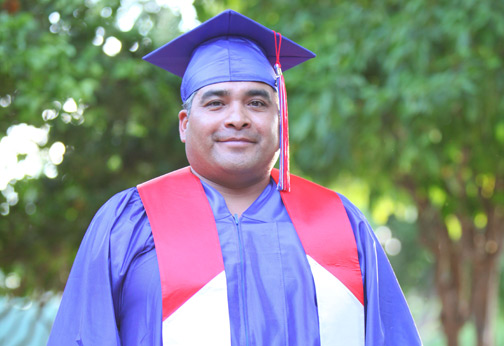 Graduate in cap and gown