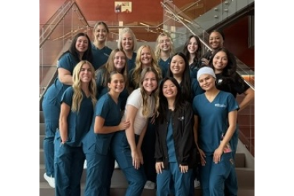 MCC Dental Hygiene Class of 2027 posed on stairway