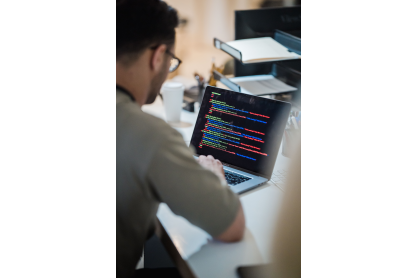 Person working on laptop computer. 