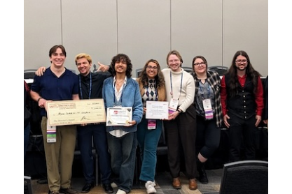 MCC students with oversized $1,000 check from USTT, the Director's Award.