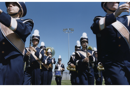 View between two rows of marching band participants. A stock image. 