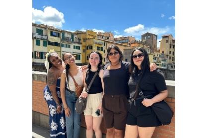 2024 Gilman scholars, Michaela Love, Erideily Garcia Cheriz, Pearl Willis, Asia Benally and Stephanie Marquez, posing on a bridge in Florence, Italy. 