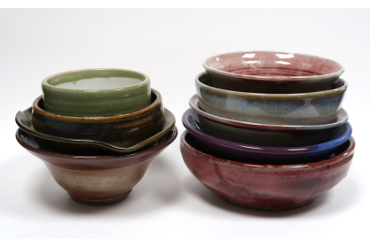 Two sets of stacked ceramic bowls. 