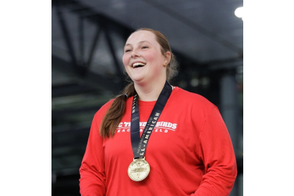 Maleah Tucker wearing the gold medal she earned at NJCAA championship. Photo credit: NJCAA