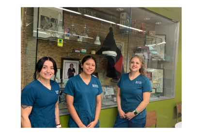 Three MCC nursing students wearing scrubs. 