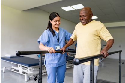 Physical therapist helping a senior man at a rehabilitation center