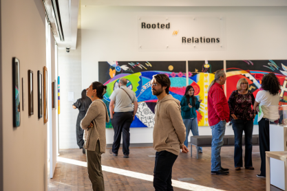 Group of people admiring an art exhibit in the Art Gallery at MCC. 