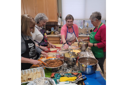 Women making tamales together