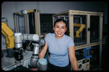 An advanced manufacturing student with robotic equipment