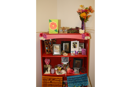 Colorful Altar with Flowers and Pictures