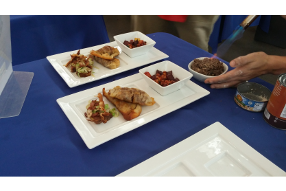 Two plates of food on a table.