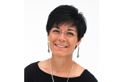 Niccole Cerveny, Ph.D. head and shoulders photo. She has short black hair and is wearing minimalistic eyeglasses and a black scooped-neck top. 