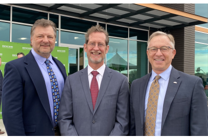 Two men wearing business suits and neckties: Dexcom General Manager Jim Kasselmann; Mesa Mayor John Giles