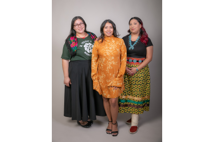 Three women in colorul traditional dresses