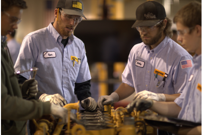 Empire Southwest employees working on equipment.