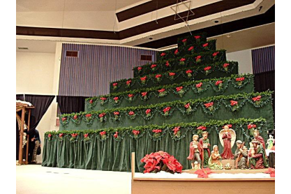 Empty risers for a choir with holiday decor.