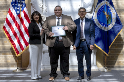 Lisa Ramirez, Director U.S. Department of Agriculture Office of Partnerships and Public Engagement (OPPE) and Roberto Velasco II, Chief Financial Officer, U.S. Forest Service, USDA HACU Leadership Group presents the Education Fellow certificate to Michael Gaspar, Mesa Community College during the 2024 USDA E. Kika De La Garza Fellows ceremony on Thursday, July 11, 2024, at the USDA in Washington D.C.