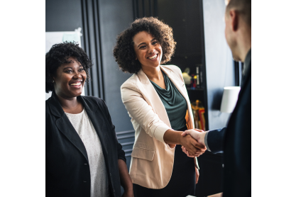 People greeting with a handshake