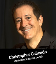 Head shot of CHRISTOPHER CALIENDO in black shirt in black background