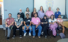Group of project participants in two rows. 