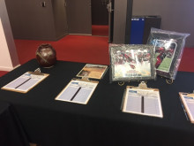 Table with items for silent auction in the lobby. 