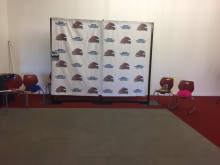 Mesa Community College backdrop with the Thunderbird logo set in PAC lobby