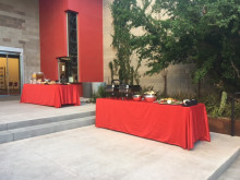 2 Tables set buffet style with a variety of food. 