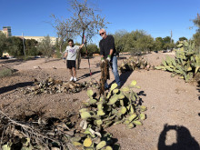 MCC alumnus Mike Rague (right) and a student clear debris during Arboretum Volunteer Days.