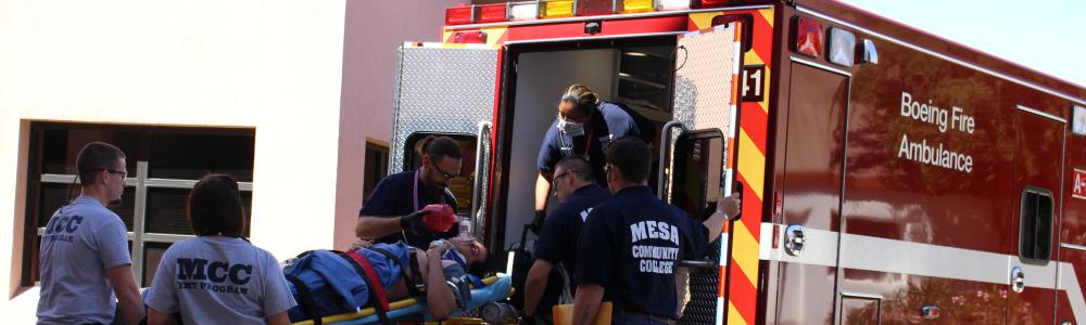 Patient being loaded into ambulance.