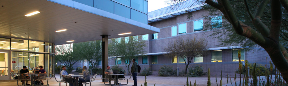 Patio of a campus building at dusk.