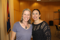 Harmony Colella posing with a colleague.