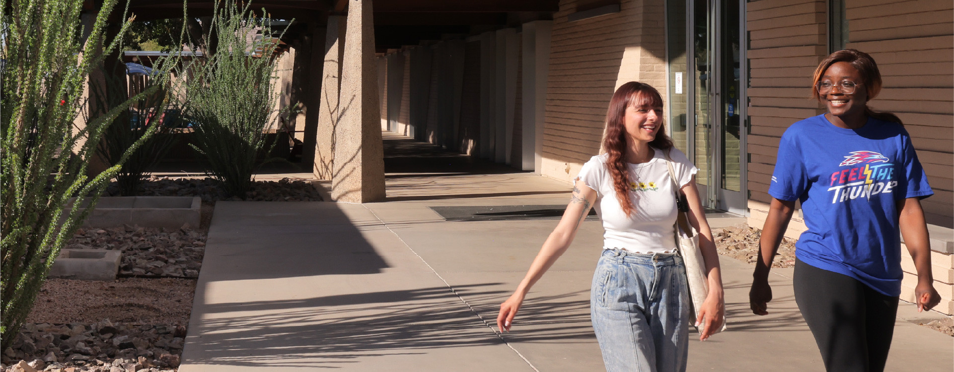 Female students walking across campus