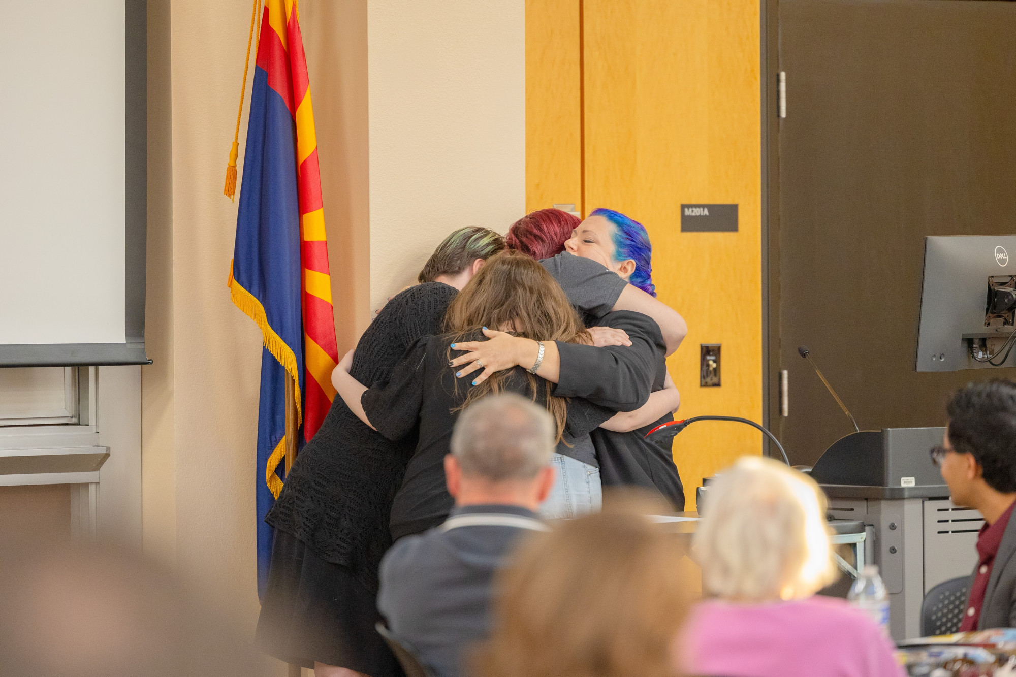 A group hug after being honored with a Summit Award