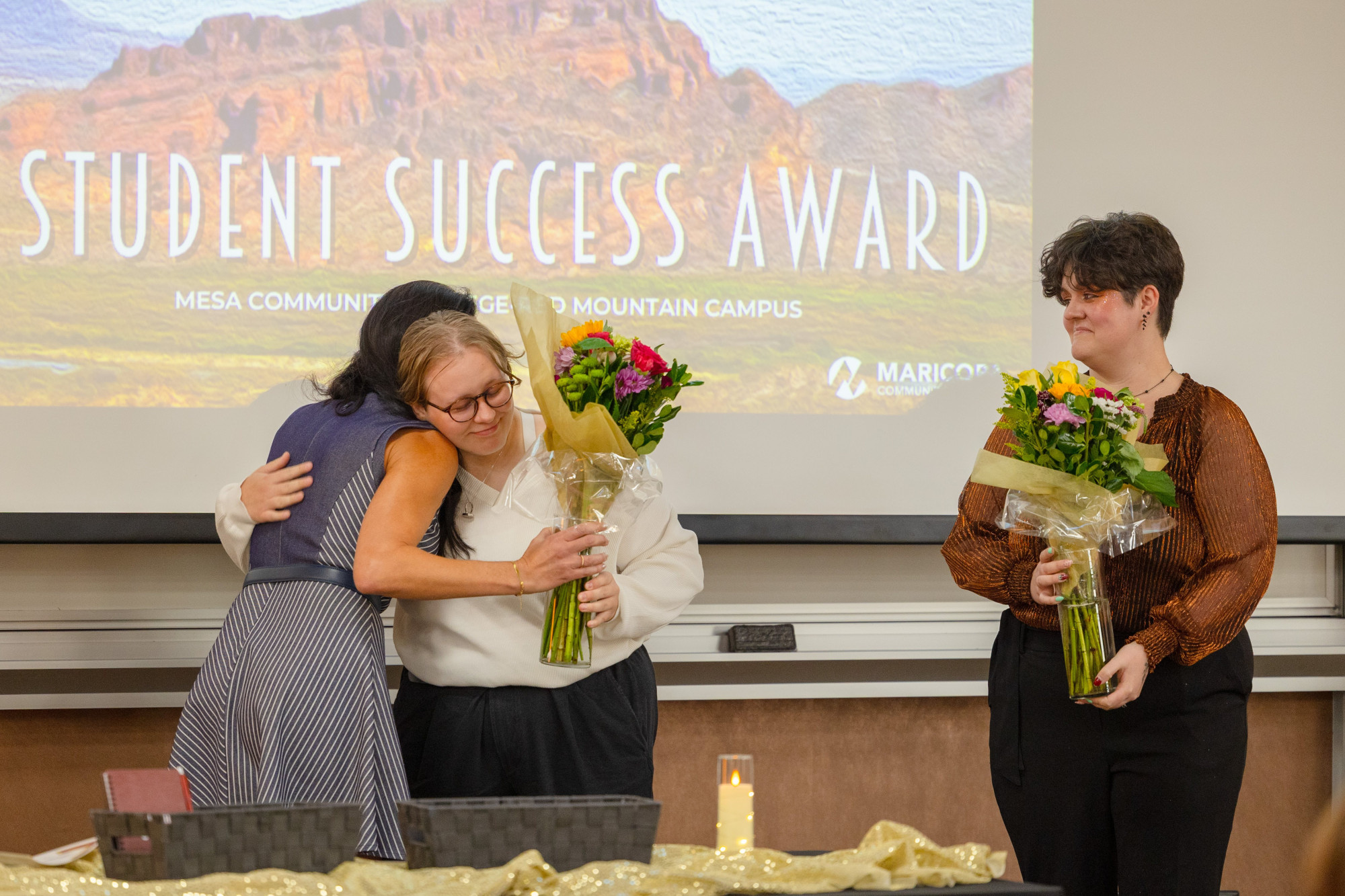 Student Government officers receiving flowers 